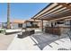 A backyard patio is perfect for entertaining with plenty of outdoor furniture and custom bar at 920 N 104Th St, Mesa, AZ 85207