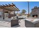 Enjoy outdoor living on this patio featuring a built in bar, fireplace, and comfortable seating at 920 N 104Th St, Mesa, AZ 85207