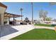 Expansive backyard featuring a custom outdoor living space with a fireplace and outdoor kitchen at 920 N 104Th St, Mesa, AZ 85207