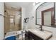 Neutral-toned bathroom with a glass shower door, granite counters, and updated fixtures at 920 N 104Th St, Mesa, AZ 85207