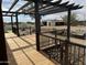 Relaxing deck with black metal pergola and desert landscaping at 920 N 104Th St, Mesa, AZ 85207