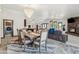 Dining room with large table, seating for six, modern chandelier and open concept at 920 N 104Th St, Mesa, AZ 85207