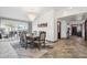 An elegant dining room with a chandelier, a patio view, and adjacent access to other rooms at 920 N 104Th St, Mesa, AZ 85207
