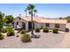 Beautiful desert home with a rust colored roof and xeriscaping at 920 N 104Th St, Mesa, AZ 85207