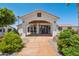 Beautiful home exterior with lush landscaping, covered entryway, and stylish accents at 920 N 104Th St, Mesa, AZ 85207