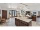 Kitchen with ample granite counter space, stainless sink and appliances, and dining area at 920 N 104Th St, Mesa, AZ 85207