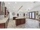 Spacious kitchen area with granite countertops, stainless steel appliances, and dining area at 920 N 104Th St, Mesa, AZ 85207