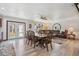 Bright and spacious living area with a comfortable sofa and a dining area perfect for gatherings at 920 N 104Th St, Mesa, AZ 85207