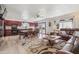 Cozy living room and kitchen area with updated appliances and a comfortable seating arrangement at 920 N 104Th St, Mesa, AZ 85207