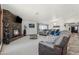 Comfortable living room featuring a stone fireplace, plush seating, and bright, airy space at 920 N 104Th St, Mesa, AZ 85207