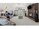 Spacious living room with a stone fireplace and comfortable seating at 920 N 104Th St, Mesa, AZ 85207