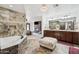 Bright main bath featuring tile accents, soaking tub and a spacious vanity at 920 N 104Th St, Mesa, AZ 85207