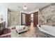 Bright main bath featuring a tiled shower, soaking tub and doorways to other rooms at 920 N 104Th St, Mesa, AZ 85207