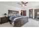A spacious main bedroom with a king bed, neutral colors, and direct access to a walk-in closet at 920 N 104Th St, Mesa, AZ 85207