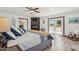 Bright main bedroom with fireplace, ceiling fan, and access to the backyard at 920 N 104Th St, Mesa, AZ 85207