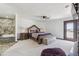 A spacious main bedroom featuring a stone-clad tub and entry to a private backyard space at 920 N 104Th St, Mesa, AZ 85207
