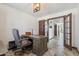Well-lit home office with an executive desk, stylish lighting, and views into the home at 920 N 104Th St, Mesa, AZ 85207