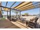 Covered patio with ample seating and views of backyard, perfect for entertaining at 920 N 104Th St, Mesa, AZ 85207