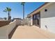 Private patio has a set of chairs and table with french doors opening to the home at 920 N 104Th St, Mesa, AZ 85207
