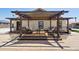 Cozy covered patio with comfortable seating, a wooden pergola, and view of the backyard at 920 N 104Th St, Mesa, AZ 85207