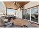 Spacious patio with ceiling fan, outdoor TV, and comfortable seating, ideal for relaxing at 920 N 104Th St, Mesa, AZ 85207