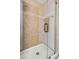 Shower has light, neutral tiling, and a clear glass door, creating a modern and bright space at 920 N 104Th St, Mesa, AZ 85207