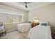 Cozy bedroom with twin beds, natural light, and neutral decor at 9484 N 105Th Pl, Scottsdale, AZ 85258