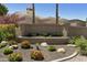 Community sign with a rock and floral landscape features the name SUNTRREE EAST at 9484 N 105Th Pl, Scottsdale, AZ 85258