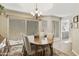 Elegant dining room with a desert view, chandelier, and a dining table at 9484 N 105Th Pl, Scottsdale, AZ 85258