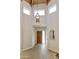 Inviting foyer with wood floors, a hanging light fixture, and a vaulted ceiling at 9484 N 105Th Pl, Scottsdale, AZ 85258