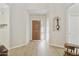 Inviting foyer with wood floors and neutral wall color at 9484 N 105Th Pl, Scottsdale, AZ 85258
