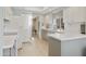 Well-lit kitchen featuring updated cabinets, appliances, and a glimpse into an adjacent space at 9484 N 105Th Pl, Scottsdale, AZ 85258