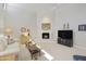 Bright living room featuring a fireplace, neutral decor and plenty of natural light at 9484 N 105Th Pl, Scottsdale, AZ 85258