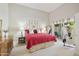 Bright main bedroom boasts a large bed, bedside tables, and access to a private outdoor patio at 9484 N 105Th Pl, Scottsdale, AZ 85258