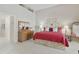Bright main bedroom featuring a large bed, matching dressers, and access to the en suite bathroom at 9484 N 105Th Pl, Scottsdale, AZ 85258