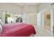Spacious main bedroom with vaulted ceilings and an exterior door leading to an outdoor patio at 9484 N 105Th Pl, Scottsdale, AZ 85258