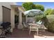 Relaxing patio with outdoor dining and grill, offering a perfect space for entertaining and enjoying the outdoors at 9484 N 105Th Pl, Scottsdale, AZ 85258