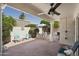 Covered patio with outdoor dining area and comfortable seating, ideal for enjoying the fresh air and backyard views at 9484 N 105Th Pl, Scottsdale, AZ 85258
