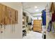 Organized walk-in closet with built-in shelving, drawers, and ample storage space for clothing and accessories at 9484 N 105Th Pl, Scottsdale, AZ 85258