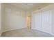 Neutral bedroom with ceiling fan, large closets and tile flooring at 9562 E Cavalry Dr, Scottsdale, AZ 85262