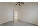 Neutral bedroom with open door and tile flooring at 9562 E Cavalry Dr, Scottsdale, AZ 85262