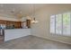Cozy dining area with a window showcasing outdoor views, next to kitchen at 9562 E Cavalry Dr, Scottsdale, AZ 85262