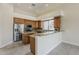 Spacious kitchen featuring stainless steel appliances and granite countertops at 9562 E Cavalry Dr, Scottsdale, AZ 85262