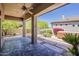 Covered patio featuring ceiling fan, concrete flooring and hot tub at 9562 E Cavalry Dr, Scottsdale, AZ 85262
