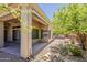 Cozy covered patio with stamped concrete and sliding glass doors, perfect for outdoor relaxation and entertaining at 9562 E Cavalry Dr, Scottsdale, AZ 85262