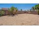 View of a backyard with gravel landscaping and block wall, offering privacy and low maintenance at 10649 W Alvarado Rd, Avondale, AZ 85392