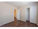 Comfortable bedroom featuring wood-look floors, easy access to the bathroom, and a closet at 10649 W Alvarado Rd, Avondale, AZ 85392