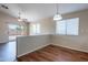 Bright dining room with slider doors and natural light creates a welcoming space at 10649 W Alvarado Rd, Avondale, AZ 85392