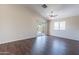 Spacious living room with sliding doors and a view of the backyard brings the outdoors in at 10649 W Alvarado Rd, Avondale, AZ 85392