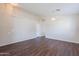 Spacious living area with a neutral color palette and laminate flooring, perfect for gatherings at 10649 W Alvarado Rd, Avondale, AZ 85392